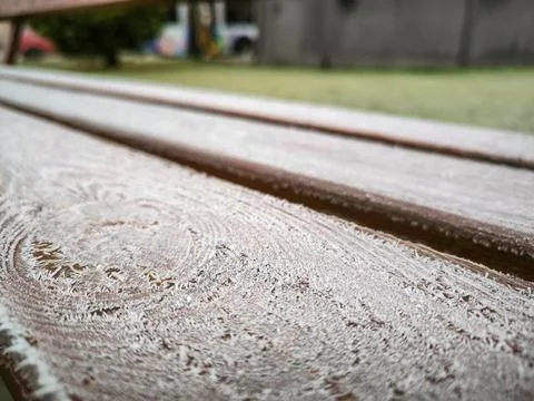 A bench covered in snow. Stock Photos