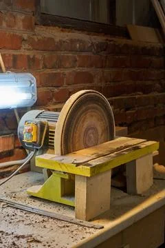 Bench disc sander with lamp in workshop Stock Photos