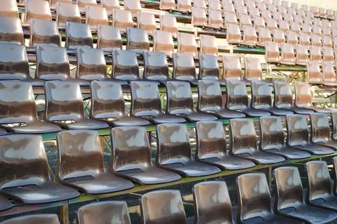 Bench with empty brown chairs, without people Stock Photos