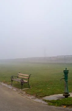 Bench in the fog Stock Photos
