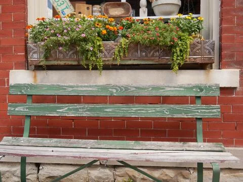 Bench in Front of Brick Building With Window and Pretty Flowers 4K Stock Photos