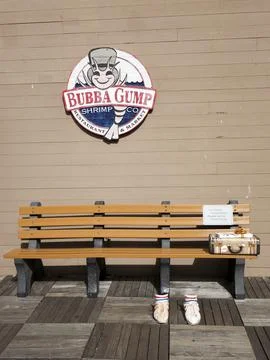 A bench in front of the Bubba Gump restaurant is San Francisco in USA Stock Photos