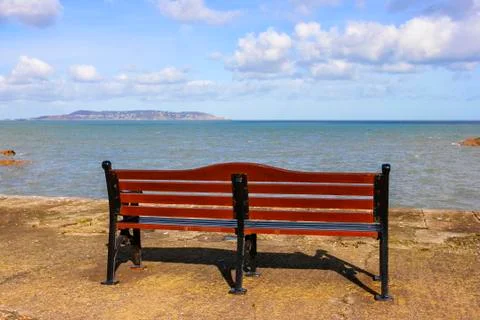 Bench in front of sea Stock Photos