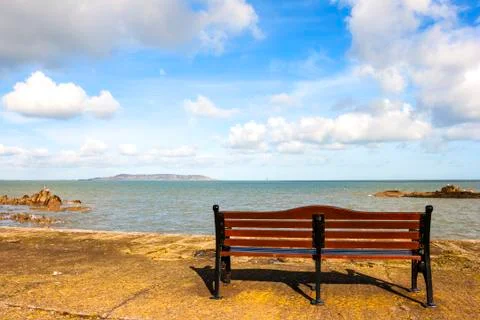 Bench in front of sea Stock Photos