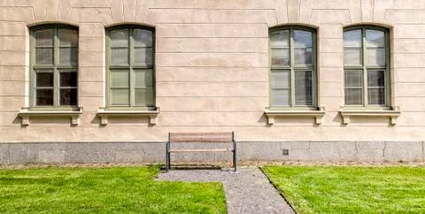 Bench in front of Windows Stock Photos