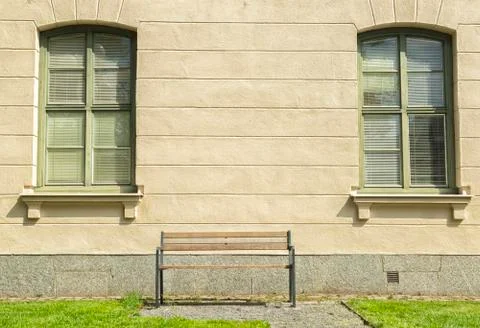 Bench in front of Windows Stock Photos