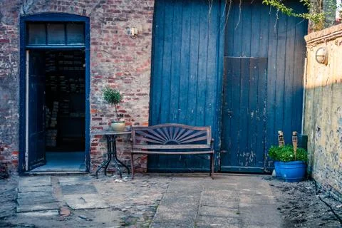 Bench at a house facade Stock Photos