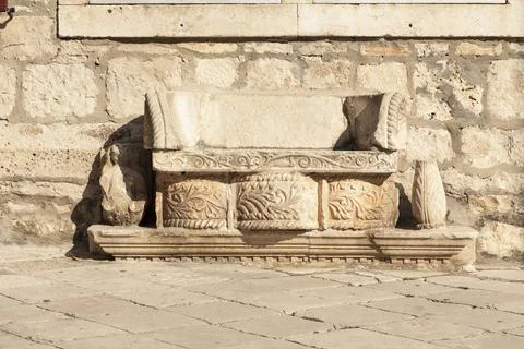 A bench in Korcula on the main square in front of St. Marks Cathedral. Croatia Stock Photos