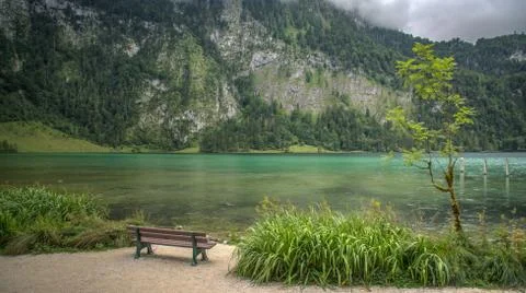 Bench at the lake side mountain view Stock Photos