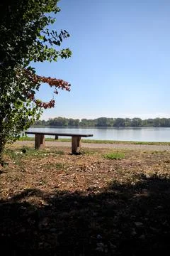 Bench by the lakeshore Stock Photos