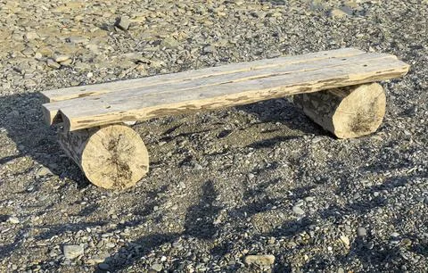 A bench made of a log Stock Photos