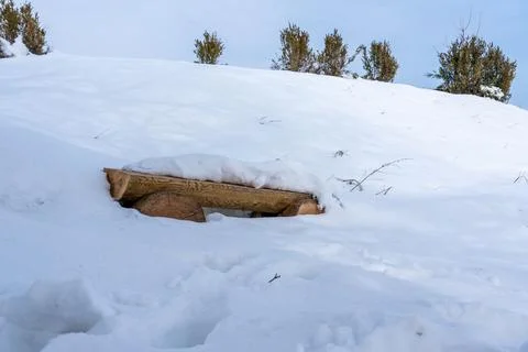 Bench in the mountains in spring, spring, March, mountains, snow, bench Stock Photos