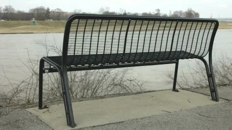 Bench next to flowing water Stock Footage 659976