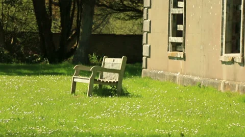 Bench outside large abandoned brick house Stock Footage 37606654