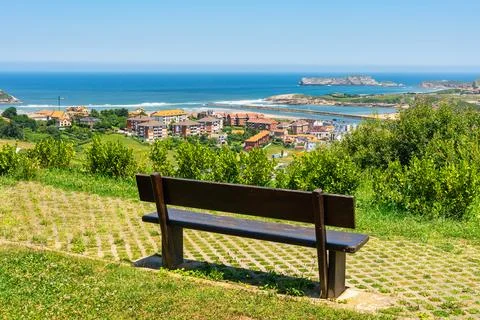 Bench overlooking the north coast of Spain and the town of Suances, Cantabria. Stock-Fotos