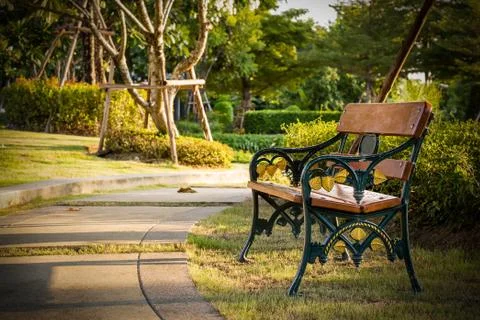 Bench in Park in Evening Stock Photos