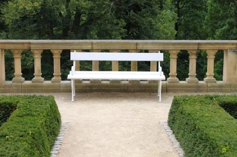 Bench in a park garden Stock Photos