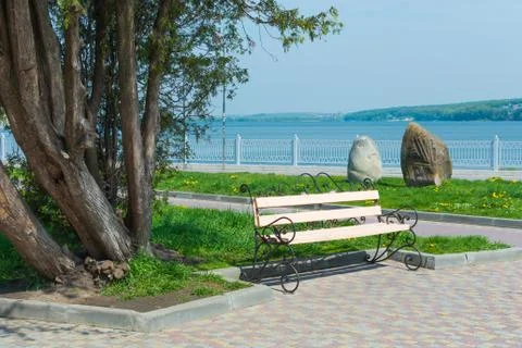 Bench in the park on the pavement Foto stock