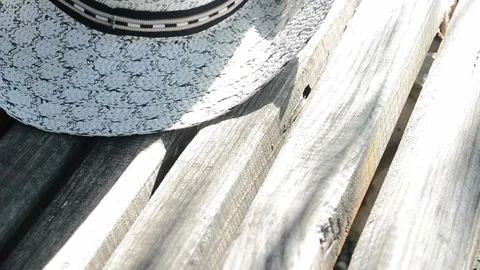 On the bench put the hat white Stock Footage 95759507