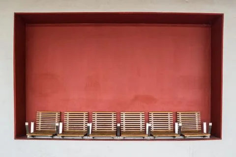 Bench on red background Stock Photos