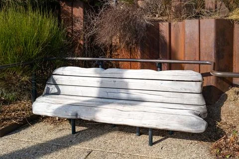 Bench for rest made of smooth polished wood 스톡 사진