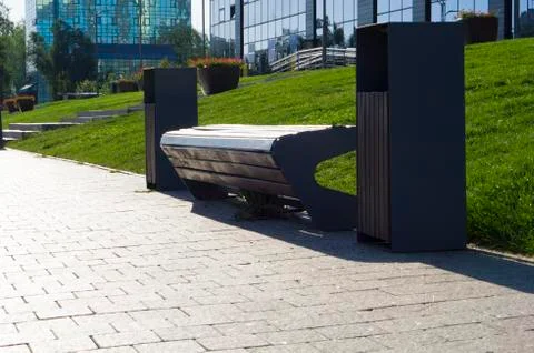 Bench for resting people while walking around the city. Stock Photos