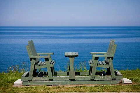 Bench by the sea Stock Photos