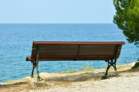 Bench by the sea. Stock Photos