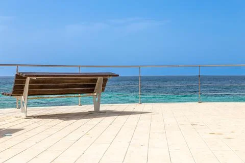 A bench with sea view Stock Photos