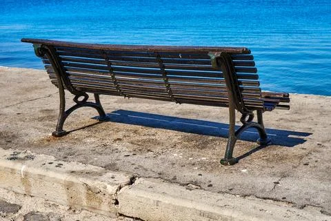 Bench on the seashore Stock Photos