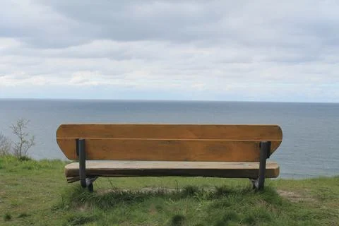 Bench on the seashore for relaxation Stock Photos