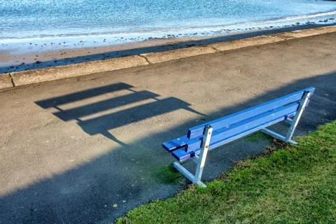 Bench seat casting a shadow Stock Photos