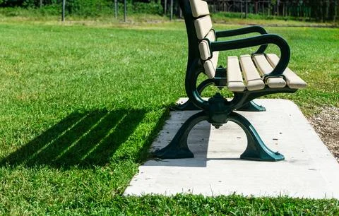 Bench with shadow in a park Stock-Fotos