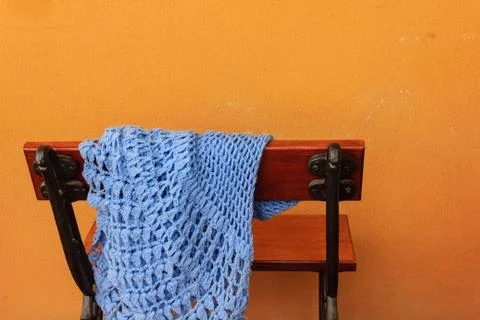 A bench with a shawl abandoned 스톡 사진