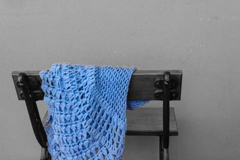 A bench with a shawl abandoned 스톡 사진