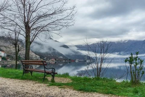 Bench at the shore Stock Photos