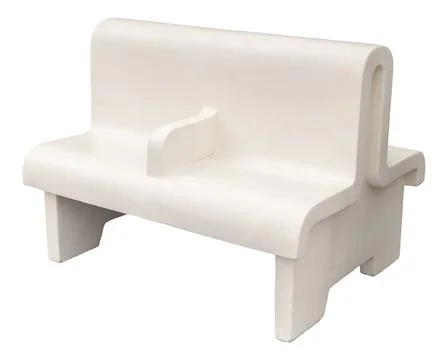 This bench showcases a simple plastic design suitable for outdoor seating are Stock Photos