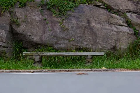 A bench on the side of the road 库存照片