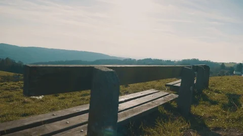 Bench on a small Hill with panorama View over Countryside | HD Stock Footage 88468147