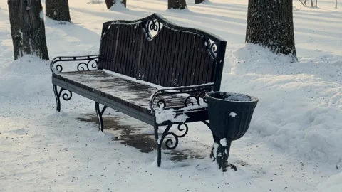 A bench in the snow in the park Video stock 329249934