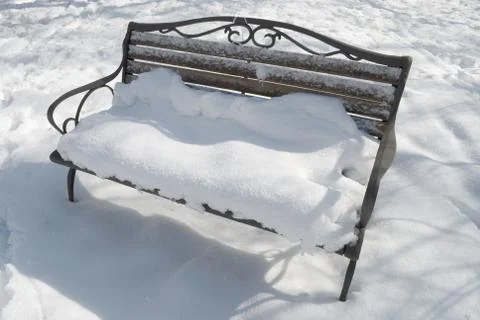 Bench in the snow Stock Photos