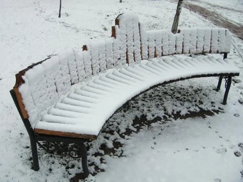 Bench in snow Foto stock
