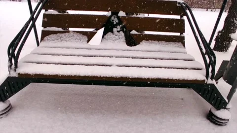 Bench in the snow on the street Stock Footage 221729461