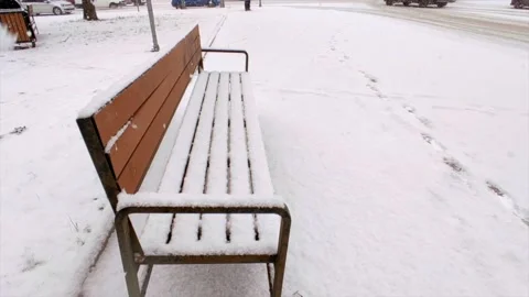 Bench in the snow on the street Stock Footage 221730968