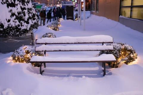 Bench on the snow on winter Stock Photos