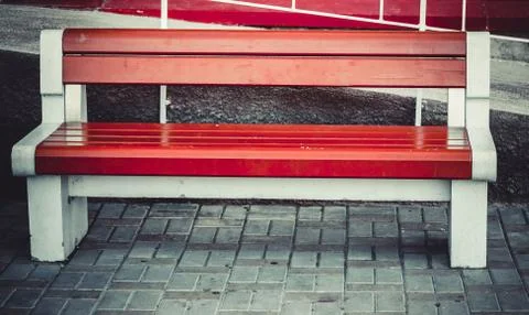 Bench standing on the old pavement Stock Photos