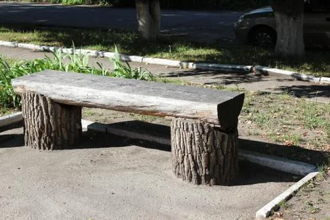 Bench from the trunk of tree Stock Photos