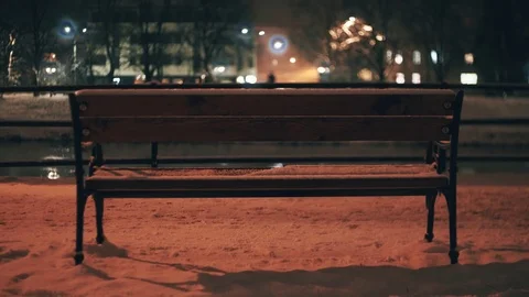 Bench under the lights in the waterfront in the winter night Vídeos de archivo 83850429