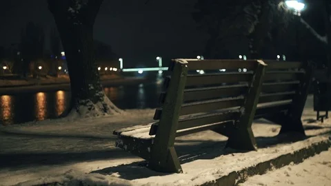 Bench under the lights in the waterfront in the winter night 스톡 동영상 83852420