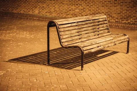Bench under night lights Stock Photos
